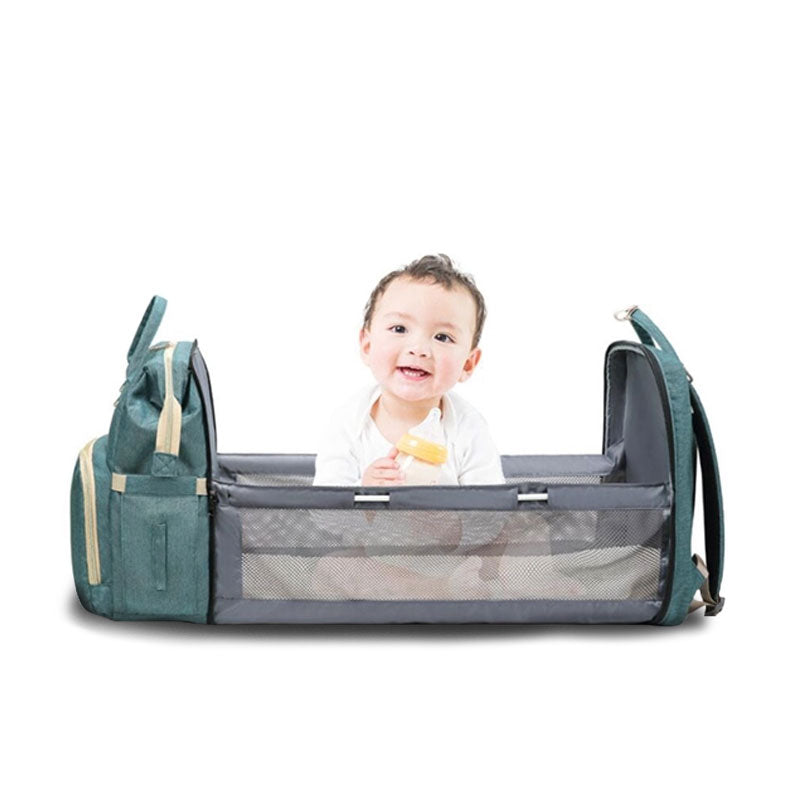 Sac à langer ouvert avec lit et matelas intégéré